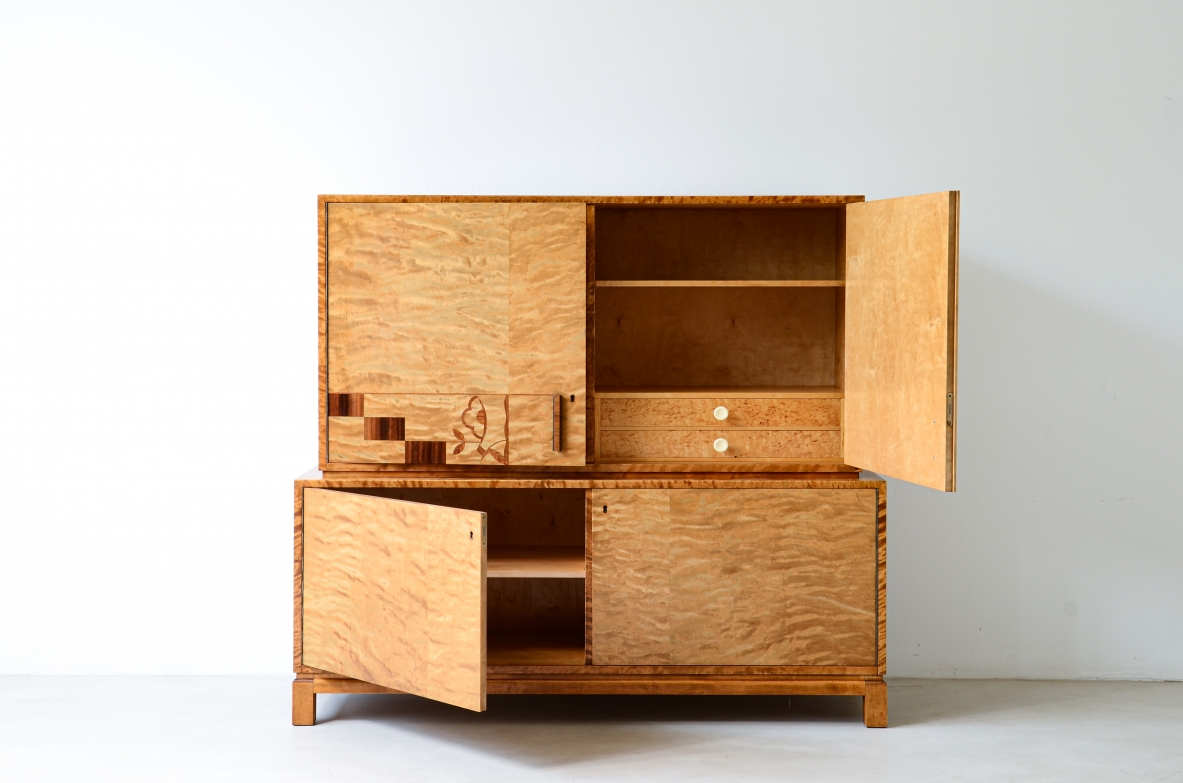 Storage unit in the style of Axel Einar Hjort, in flamed maple with Art Deco inlays on the front.  Sweden  approx. 1930