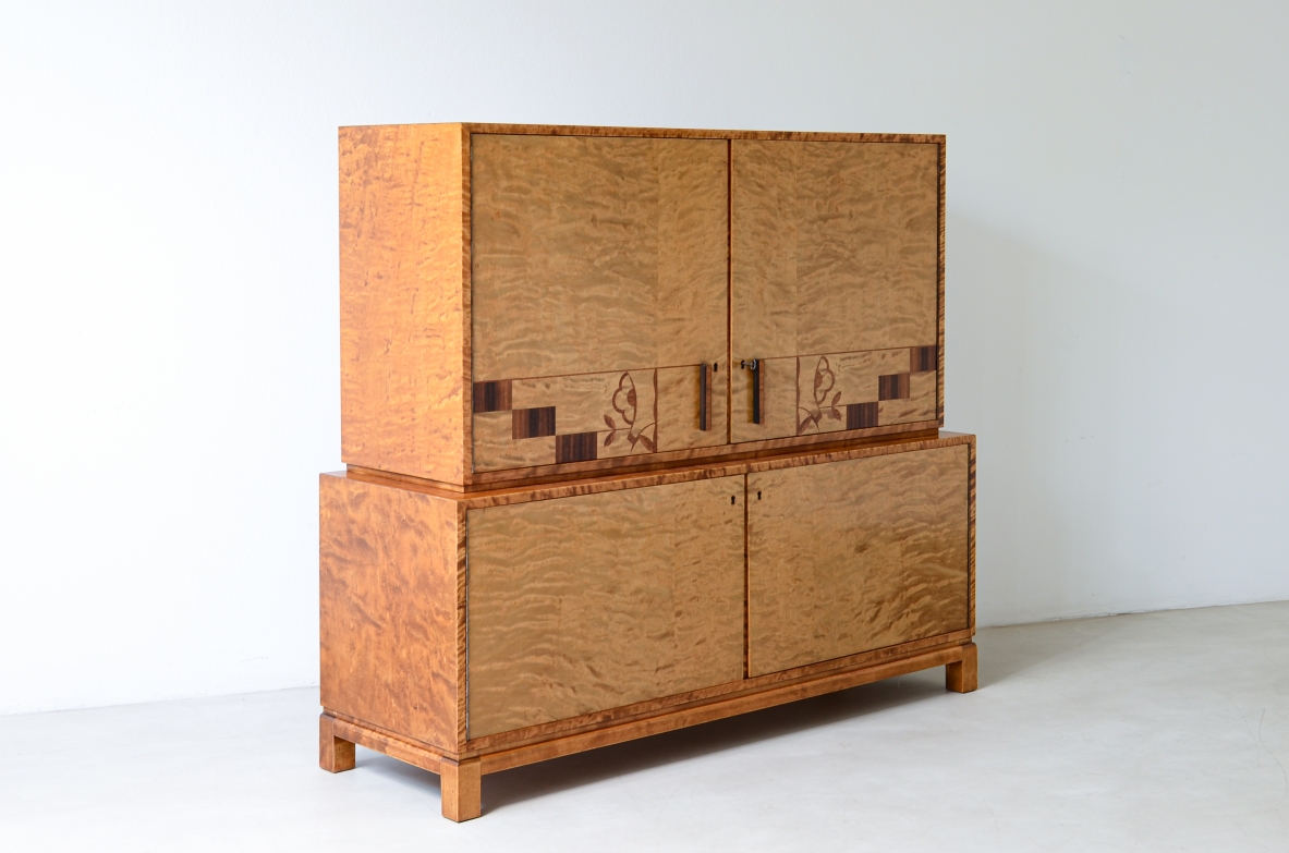 Storage unit in the style of Axel Einar Hjort, in flamed maple with Art Deco inlays on the front.  Sweden  approx. 1930