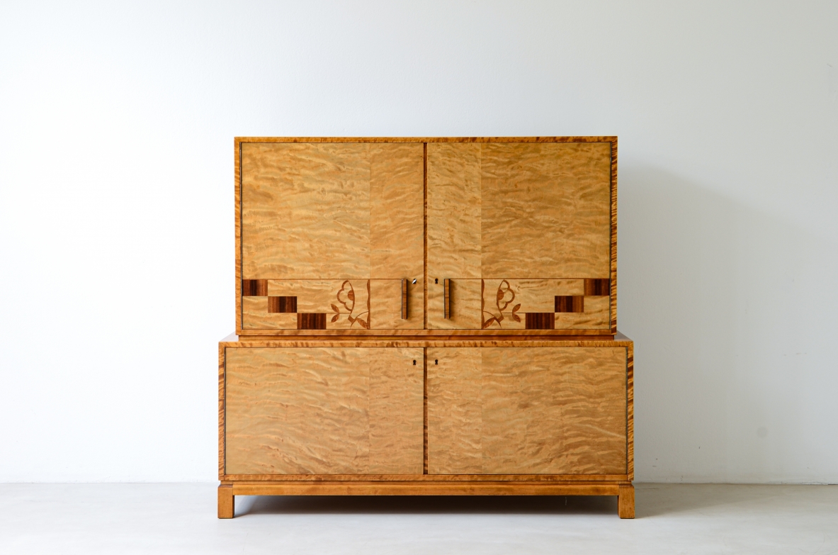 Storage unit in the style of Axel Einar Hjort, in flamed maple with Art Deco inlays on the front.  Sweden  approx. 1930