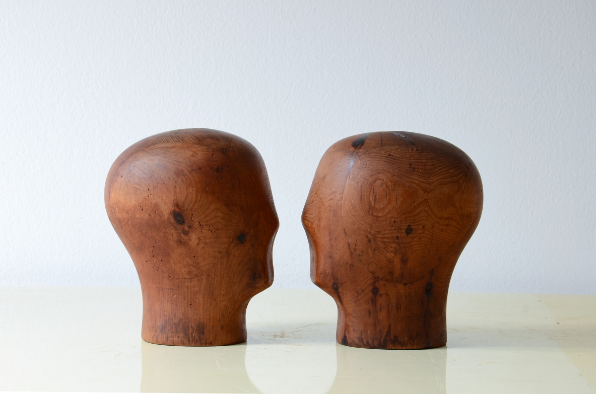 Two heads in turned and carved pine wood.  French manufacture, 1930s.