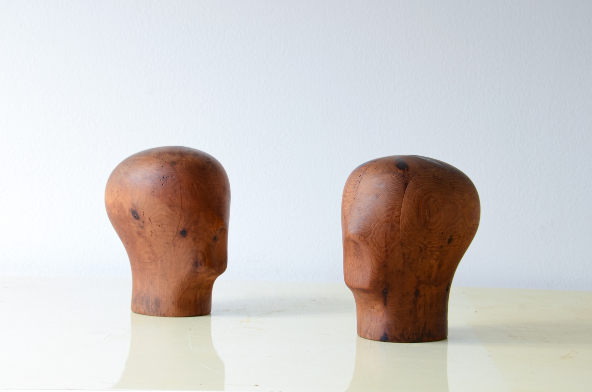 Two heads in turned and carved pine wood.  French manufacture, 1930s.