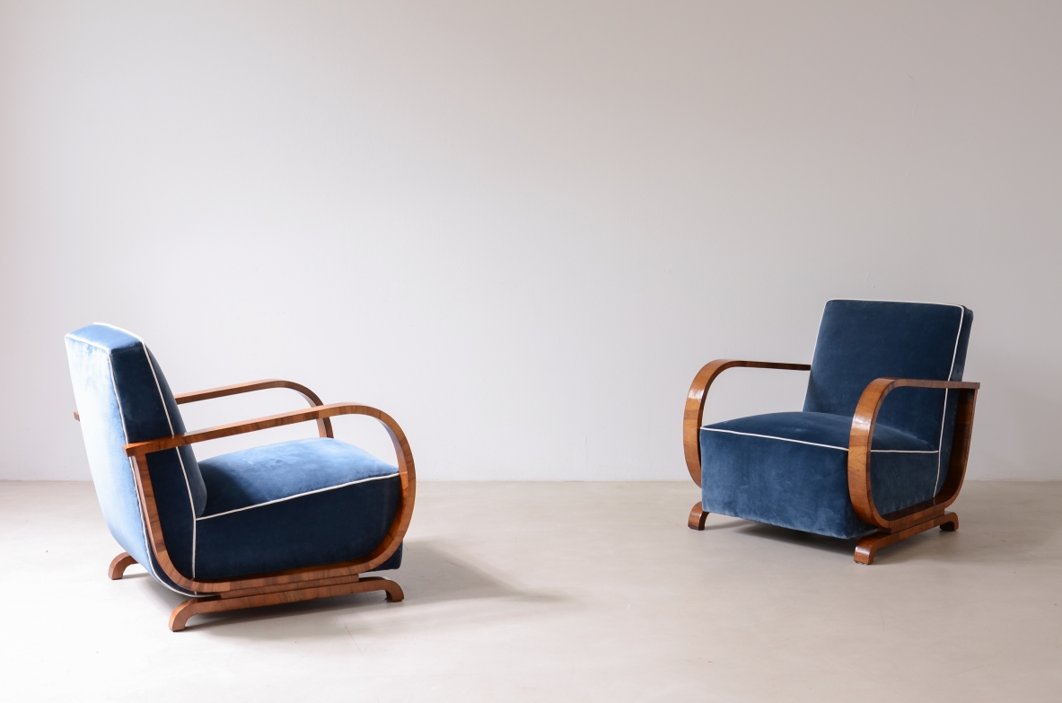 Pair of armchairs with curved wooden armrests and padded velvet seat.  Hungarian manufacture, 1930s-40s.