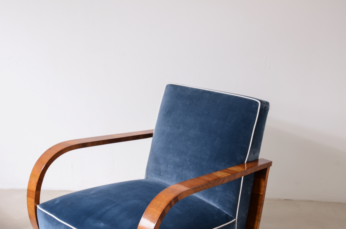 Pair of armchairs with curved wooden armrests and padded velvet seat.  Hungarian manufacture, 1930s-40s.