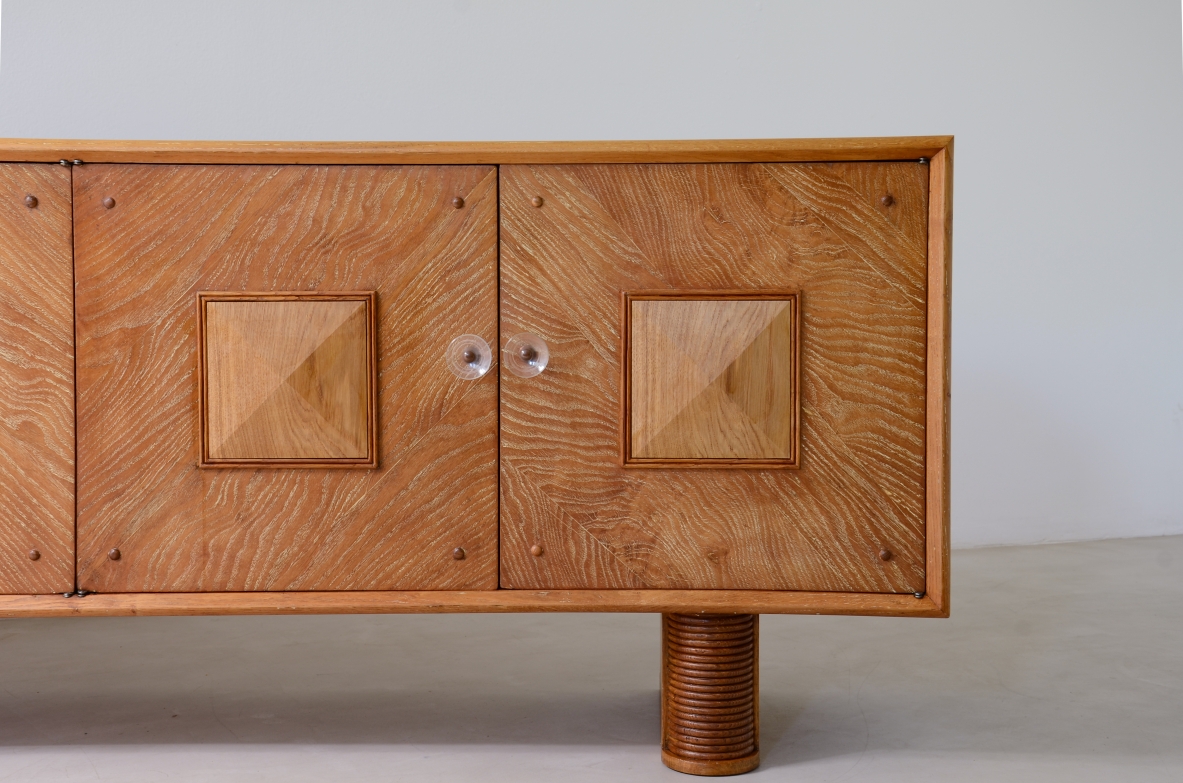 Large 4-door oak cabinet with central diamond decorative motif and curved wood bases, 1940.v