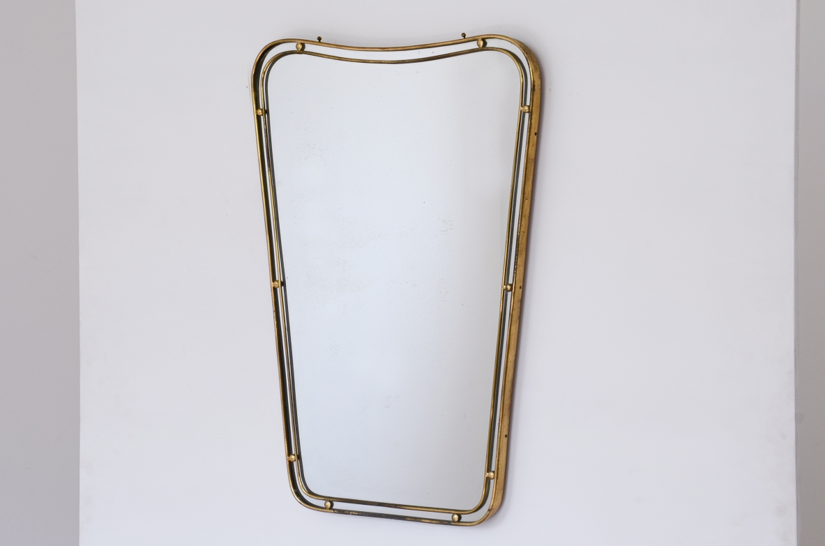 Mirror with double profile shaped brass frame with ball spacers.  Italian manufacture ca. 1950.