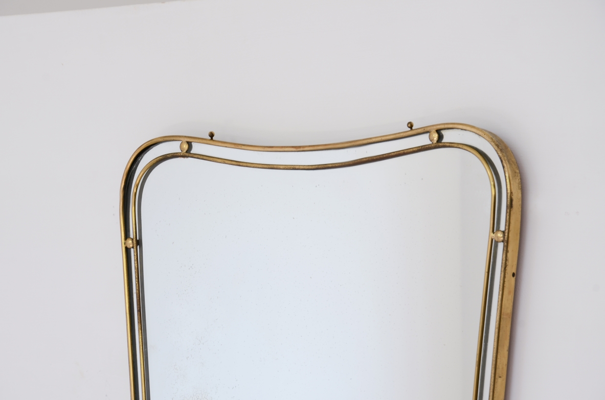 Mirror with double profile shaped brass frame with ball spacers.  Italian manufacture ca. 1950.