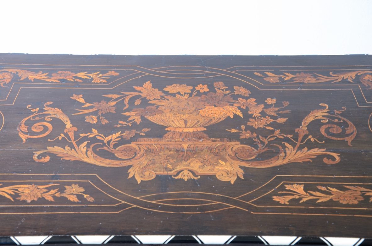 table finely inlaid in various woods and profiled in ivory 1850