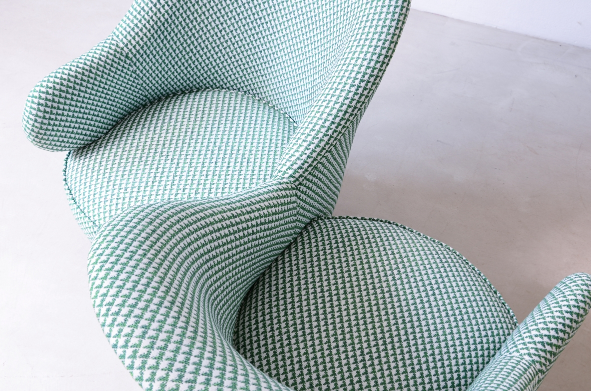 Conversation sofa for two, upholstered in padded fabric.  Italian manufacture, ca.1950.