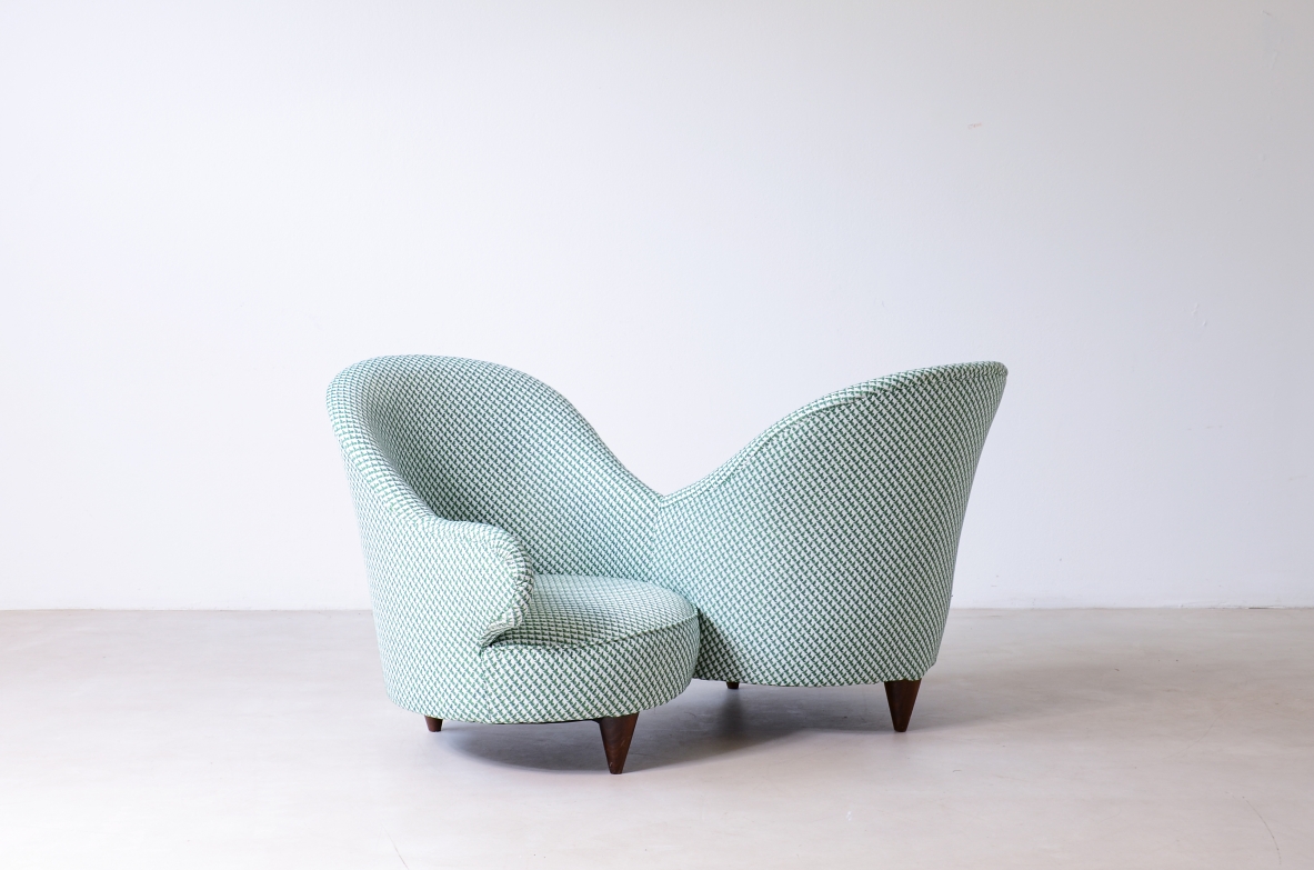 Conversation sofa for two, upholstered in padded fabric.  Italian manufacture, ca.1950.