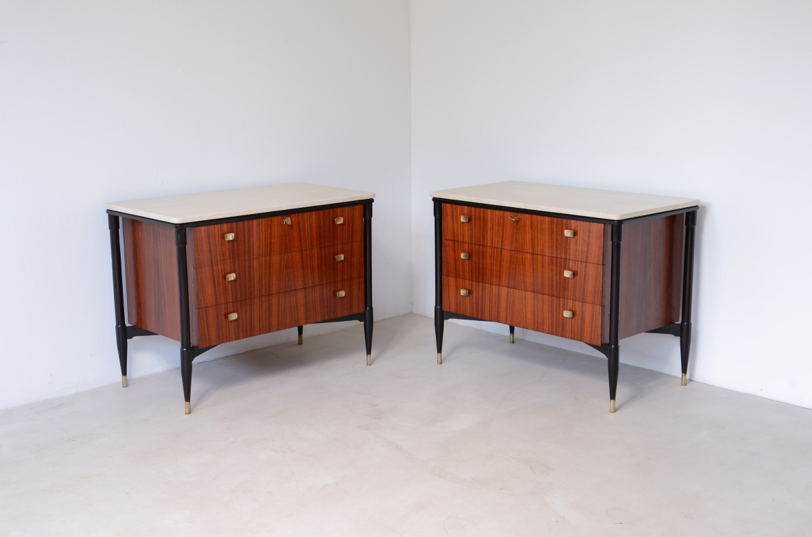 elegant walnut cabinets with travertine tops, three drawers with shaped brass handles. Italian manufacture, circa 1955.