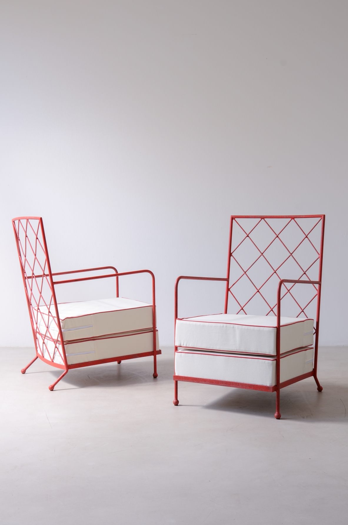Pair of iron and iron rod armchairs  handcrafted from a design by Jean Royere.