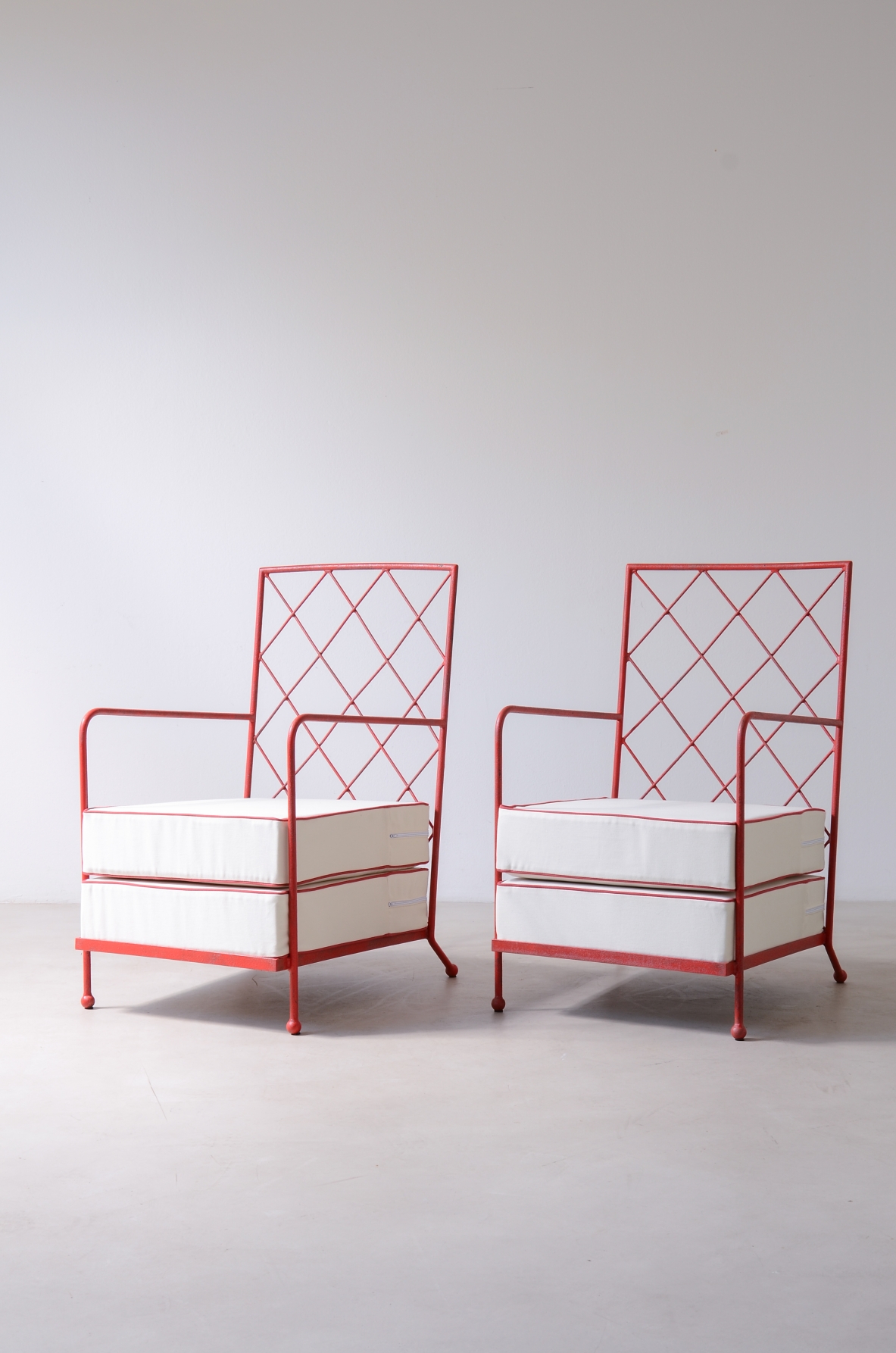 Pair of iron and iron rod armchairs  handcrafted from a design by Jean Royere.
