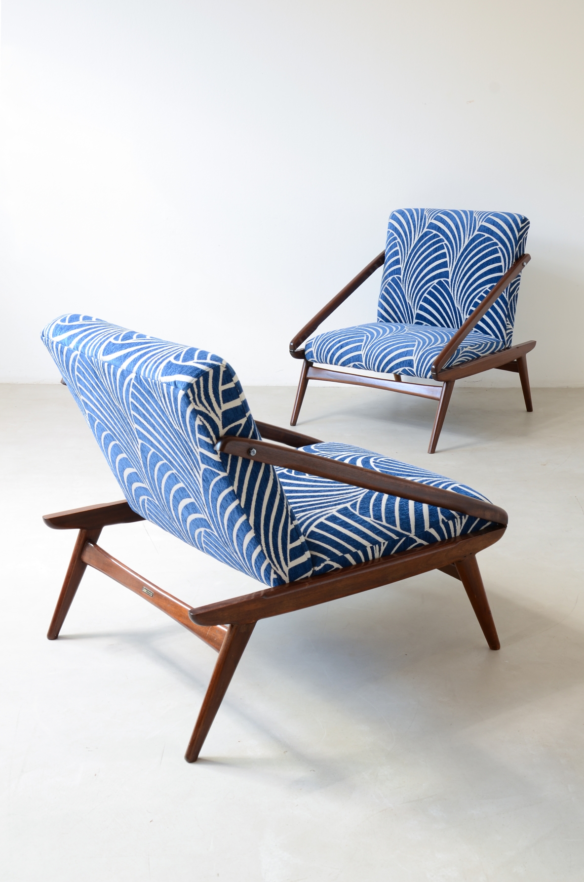 pair of wooden reclining armchairs, Made by ISA Bergamo in 1954.