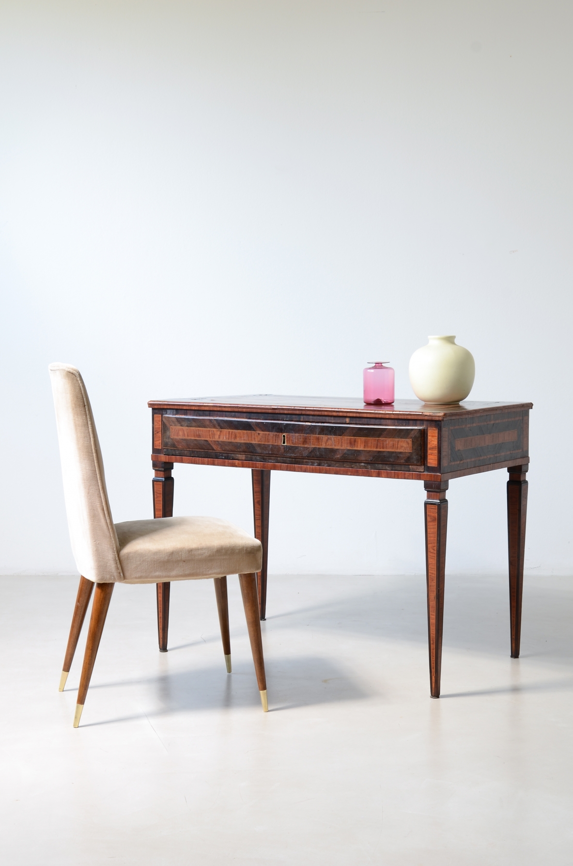 Elegant centerpiece writing table in fine wood veneer.  Italy, ca. 1780.