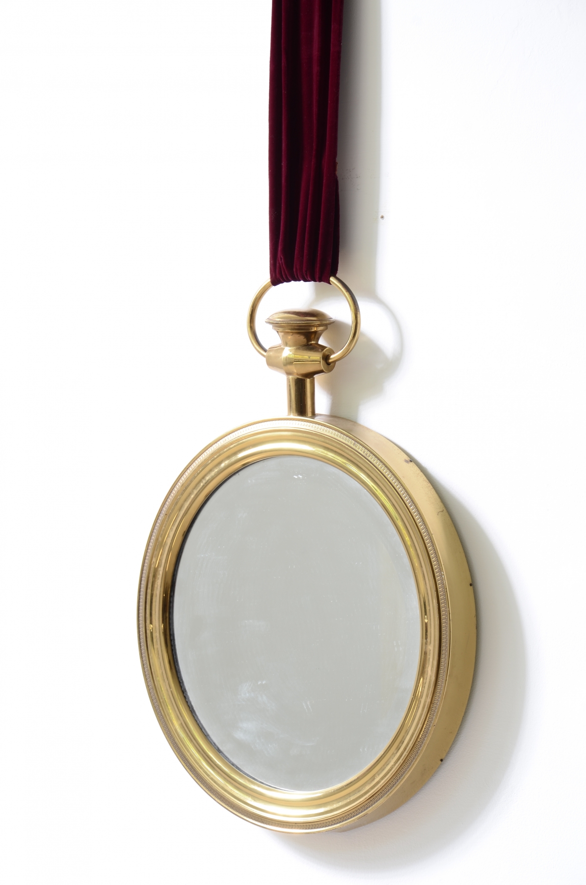 Elegant shaped brass mirror In the style of Piero Fornasetti. 1955