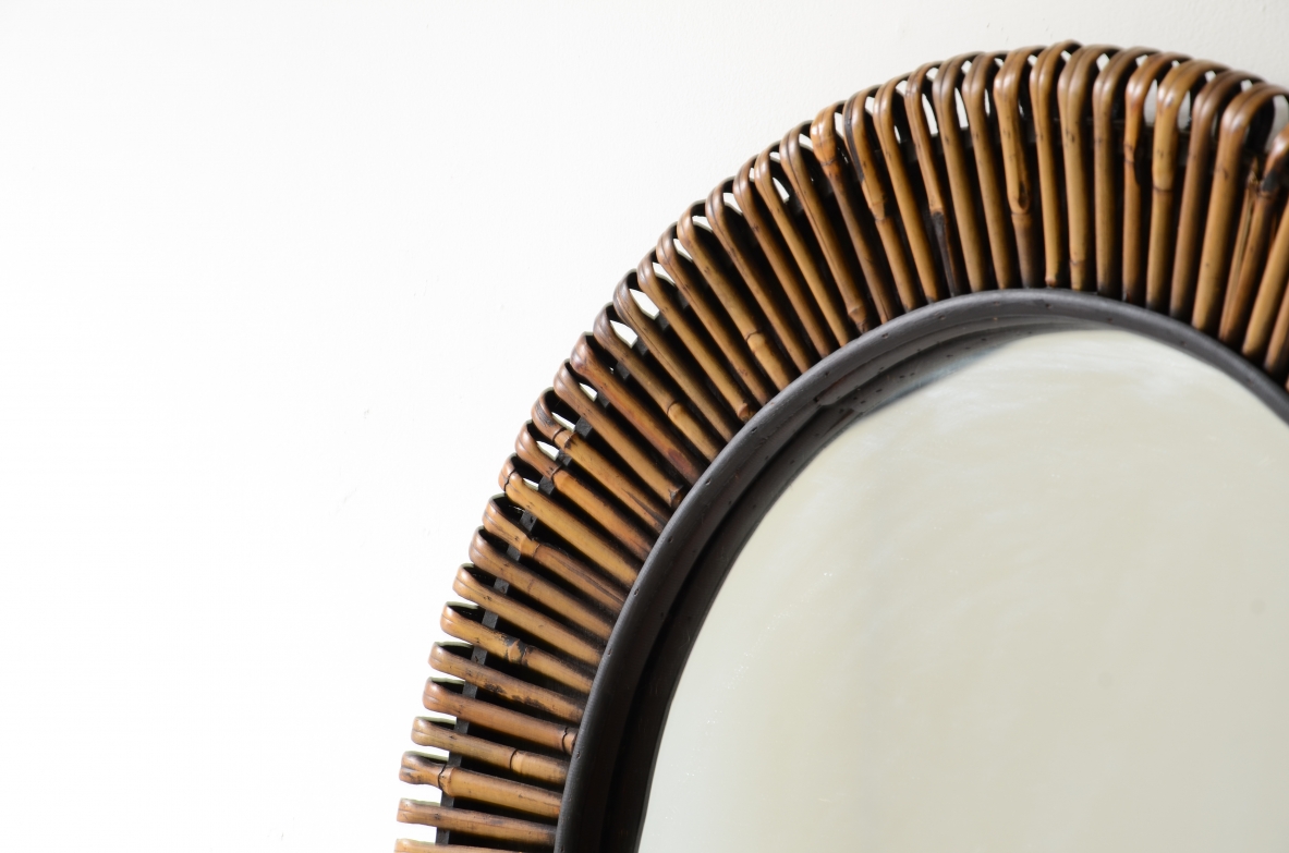 Beautiful mirror with a sunburst cane frame.  Italian manufacture, circa 1950-60.