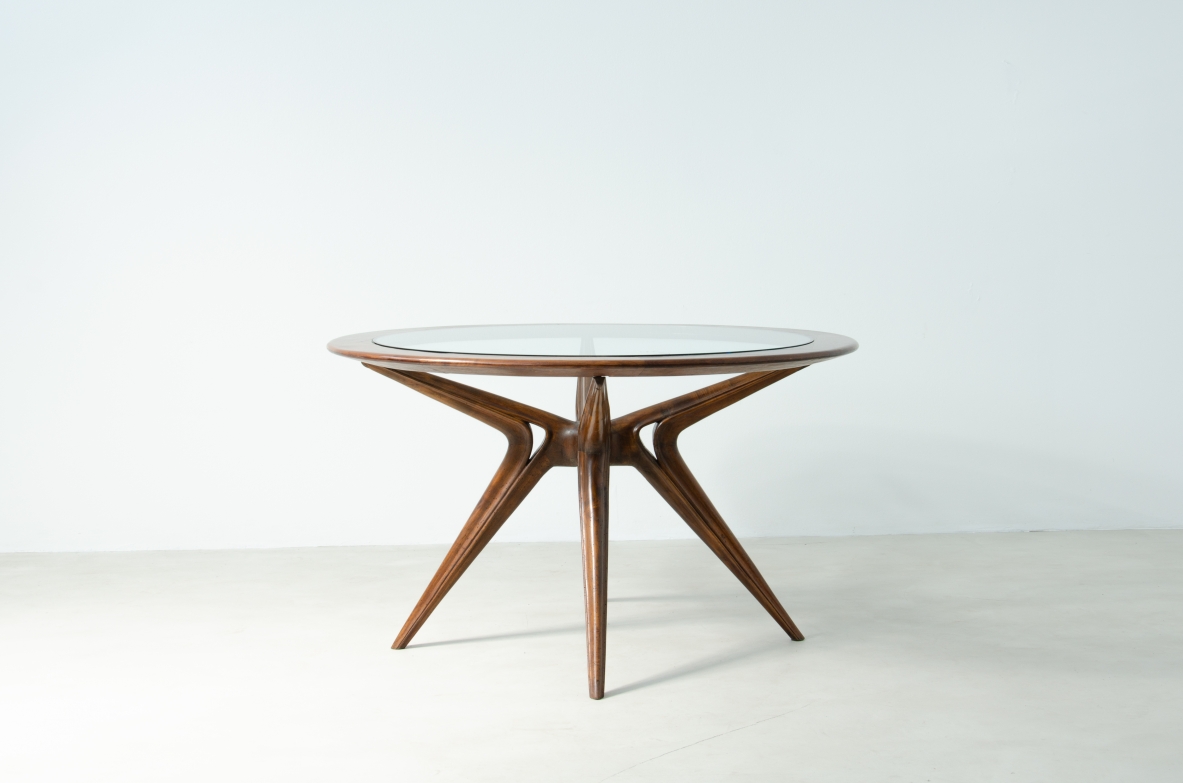 Tavolo da pranzo con struttura a forma organica e piano con fascia in legno e cristallo di grande spessore. Attr. Gianni Vigorelli, 1950ca.