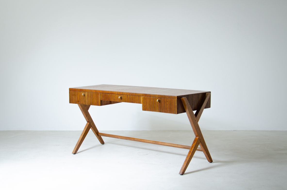 Oak desk with three drawers with ribbed wood band and curved top supported by double Y legs.  Turin School, Italy, 1950's.