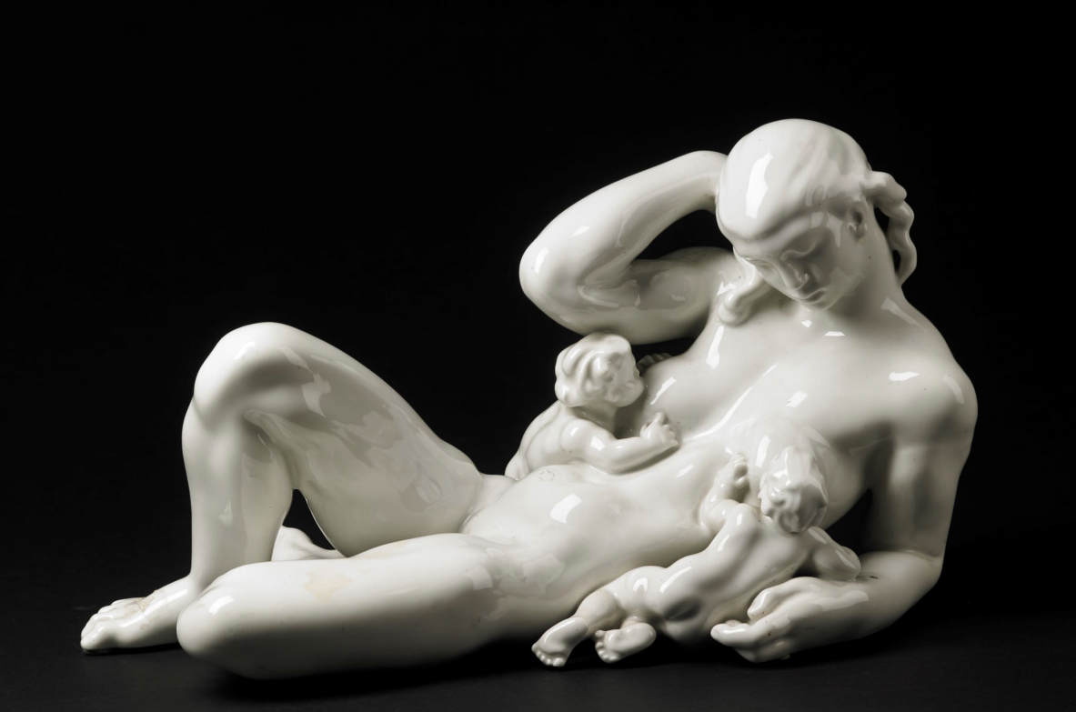 "The Water Mother".  Glazed ceramic with a reclining female figure and two children.  Made for the international exhibition of decorative arts in Paris in 1925.  Kay Nielsen, Bing & Grondhal, Copenhagen, 1925.