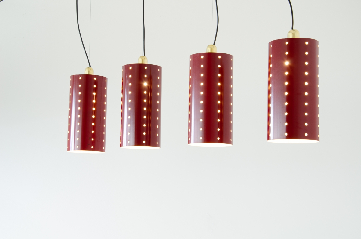 Quattro lampade a cilindro in metallo laccato e forato con bicchiere in ottone.  Manifattura italiana 1960ca.