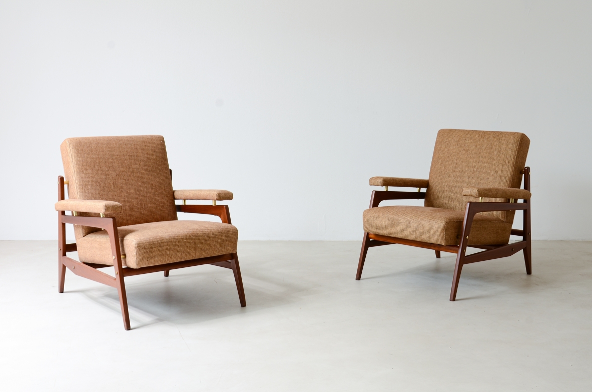 Pair of modernist armchairs with design wood structure and brass spacers.  Italian manufacture around 1955.